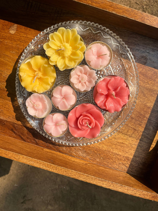 Indiglow flower-shaped tealight candle for decorative displays and gifting.