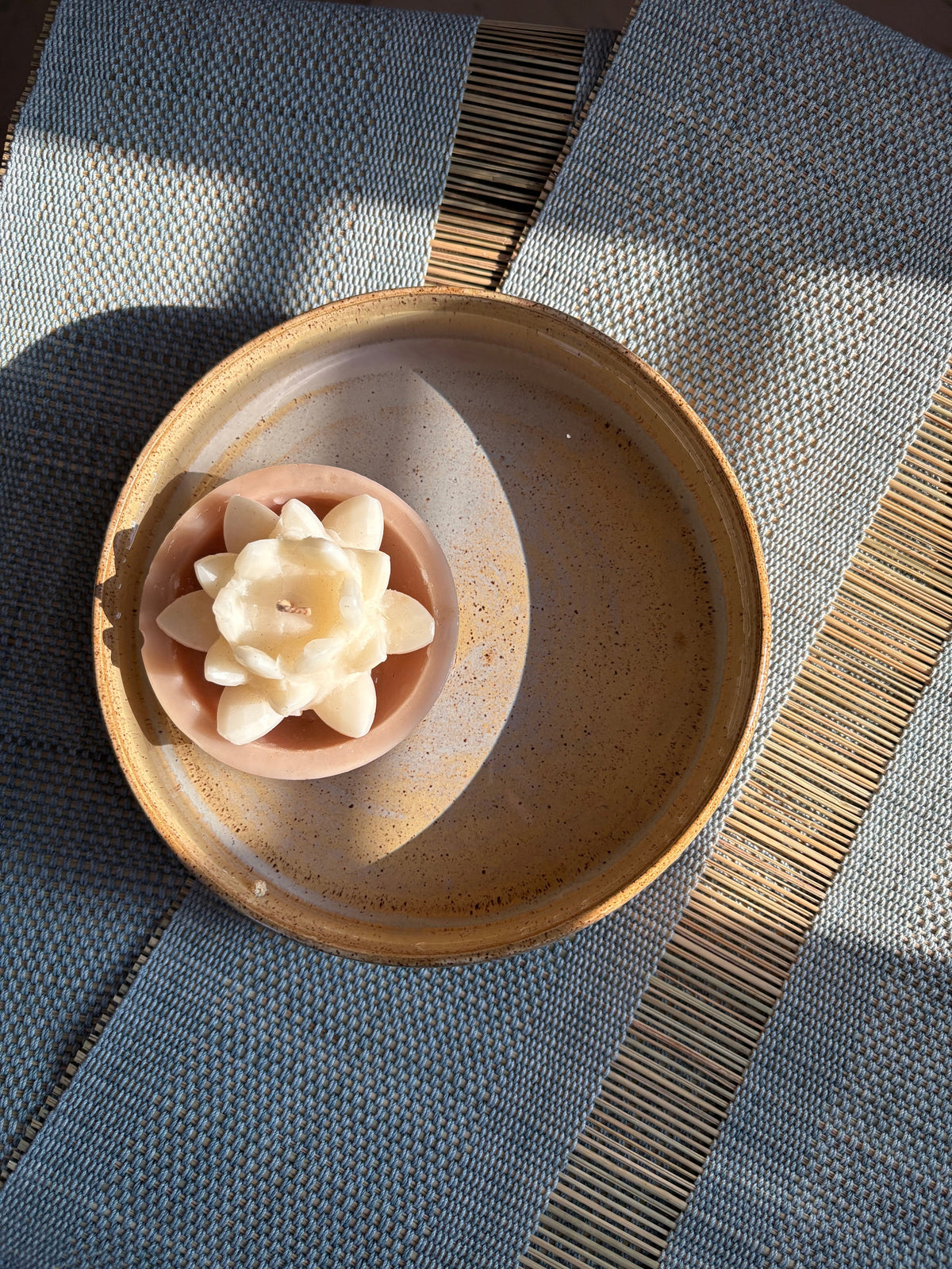 Indiglow Cup Lotus Floater candle featuring a lotus-inspired floating candle design.