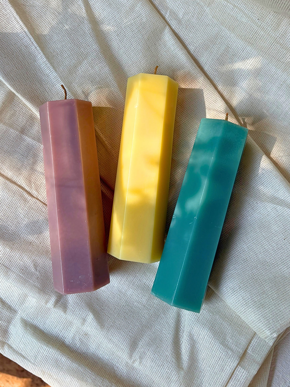 Indiglow hexagonal pillar candle with a geometric shape for decorative arrangements.