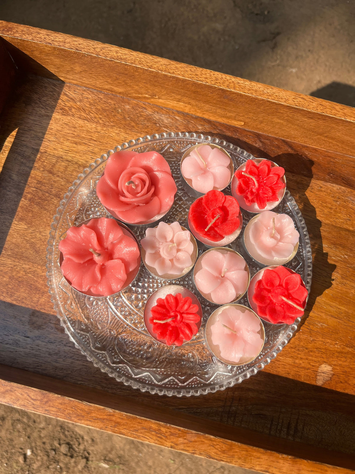 Indiglow flower-shaped tealight candle for decorative displays.